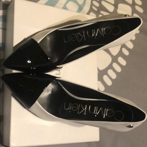 White and black Calvin Klein pumps